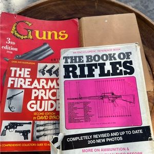 Assorted Vintage books about gun